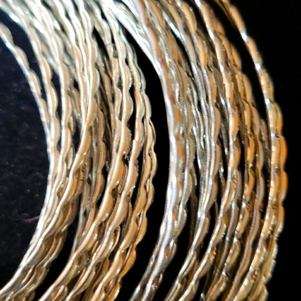 Statement bracelet. 44 bright silver tone interlocked bangles - Picture 2 of 5